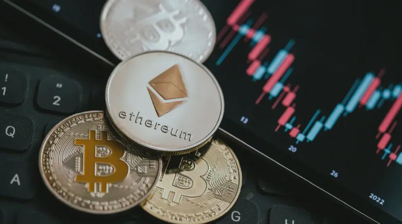 An image of an Ethereum coin with several Bitcoin coins and a price chart in the background